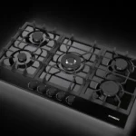 هيونداي - سطح سيراميك أسود 5 شعلات غاز (شعلة ثلاثيه) شبك من المعدن (ثقيل) خاصية الاشعال الذاتي صمام أمان كامل - مفاتيح للتحكم أمامية - HY-TG90GF